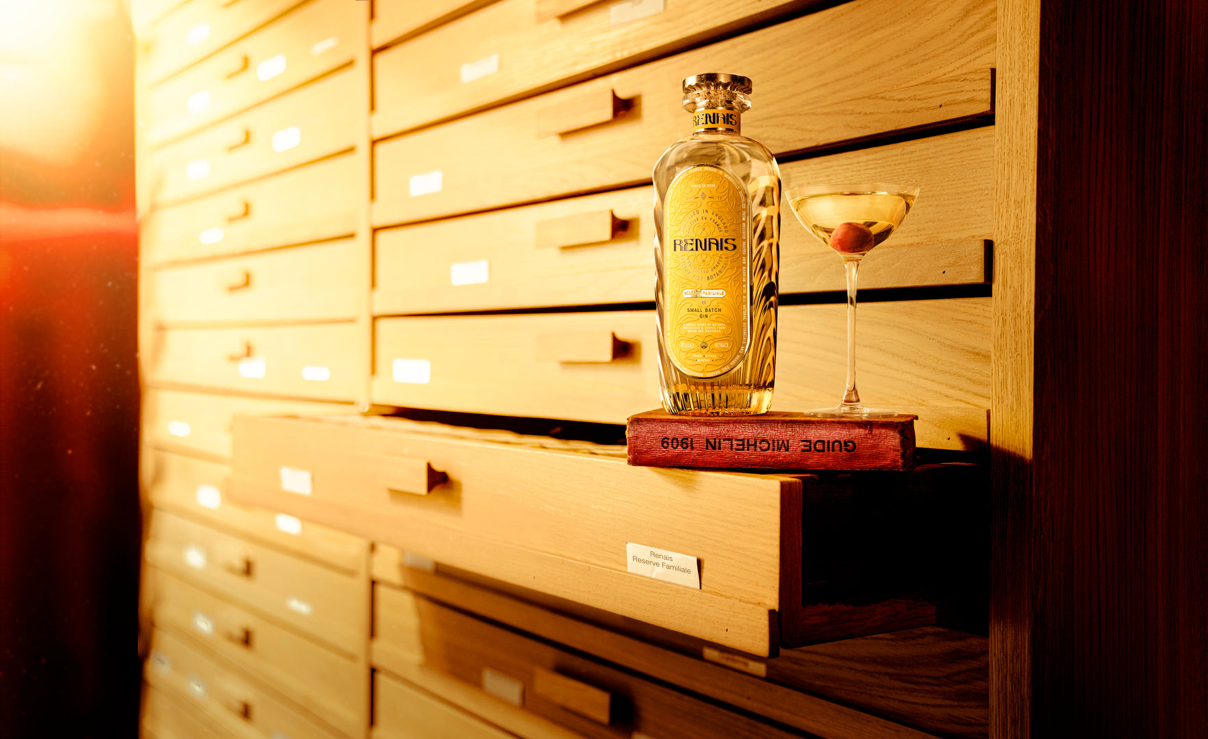 A bottle of Renais beside a finished cocktail